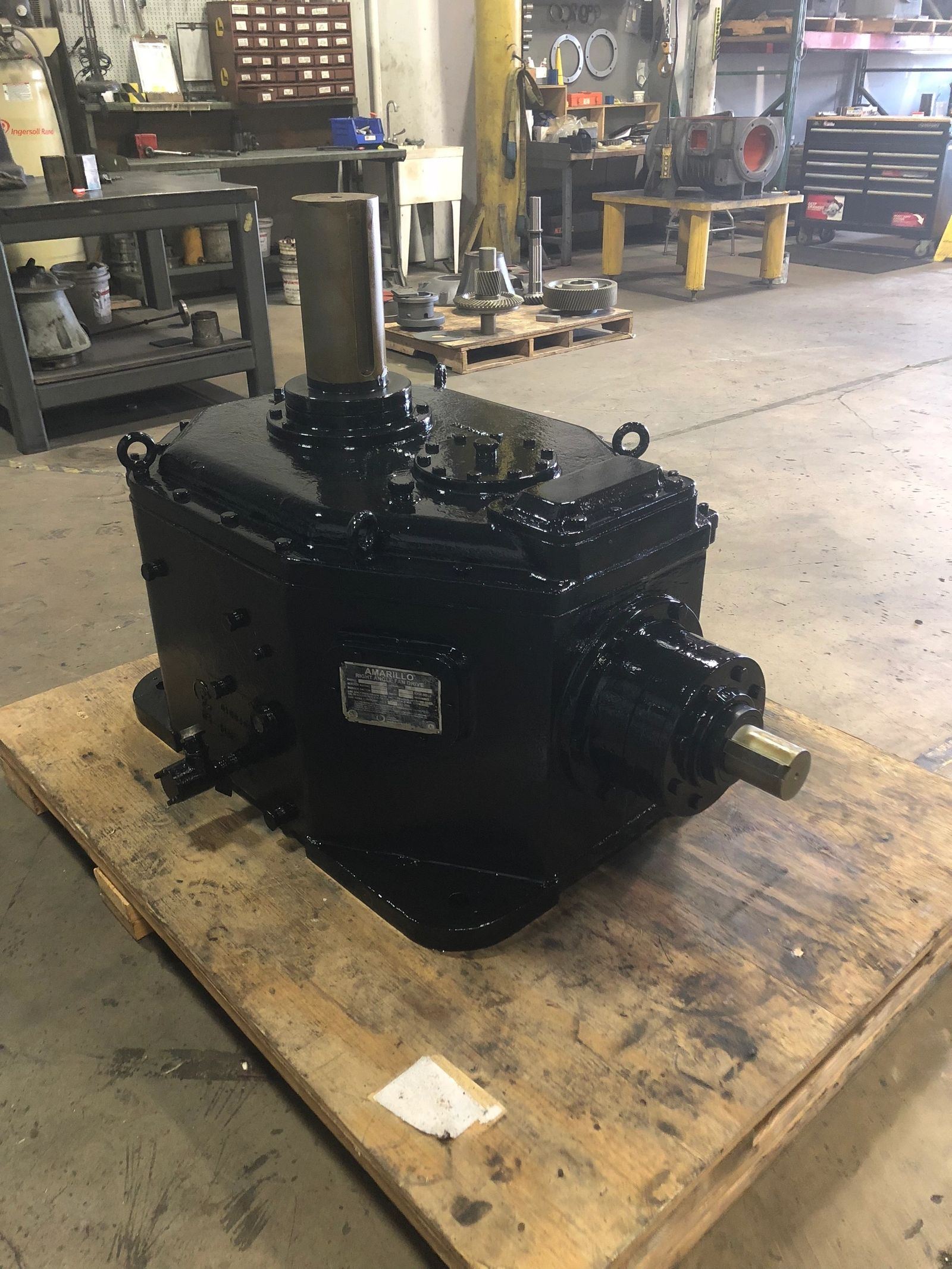 Amarillo cooling tower gear reducer on a pallet awaiting teardown