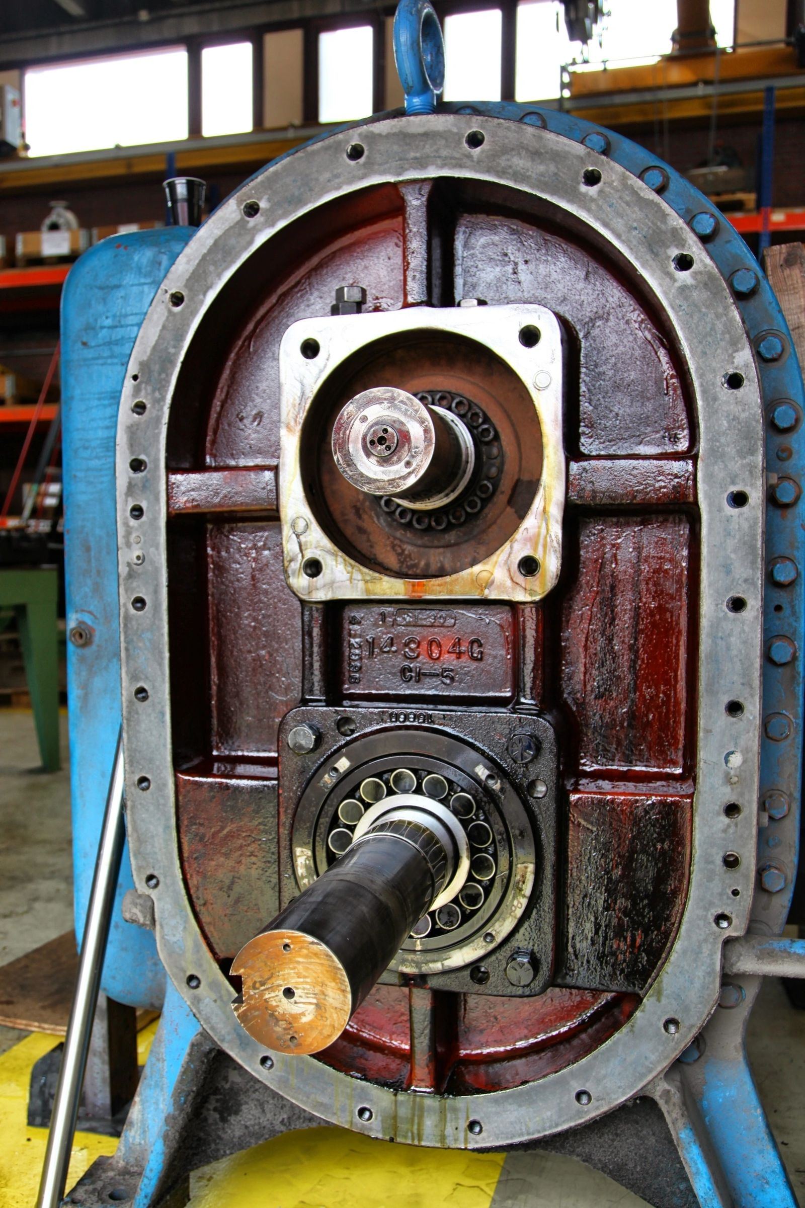 Opened gearbox housing showing internal components during inspection