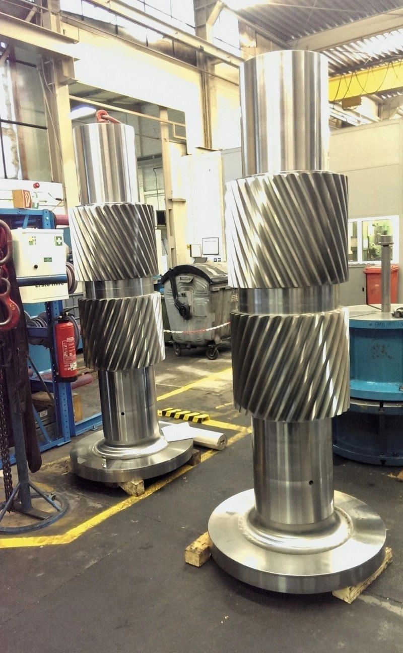 Machined helical pinion shafts standing ready for gearbox assembly