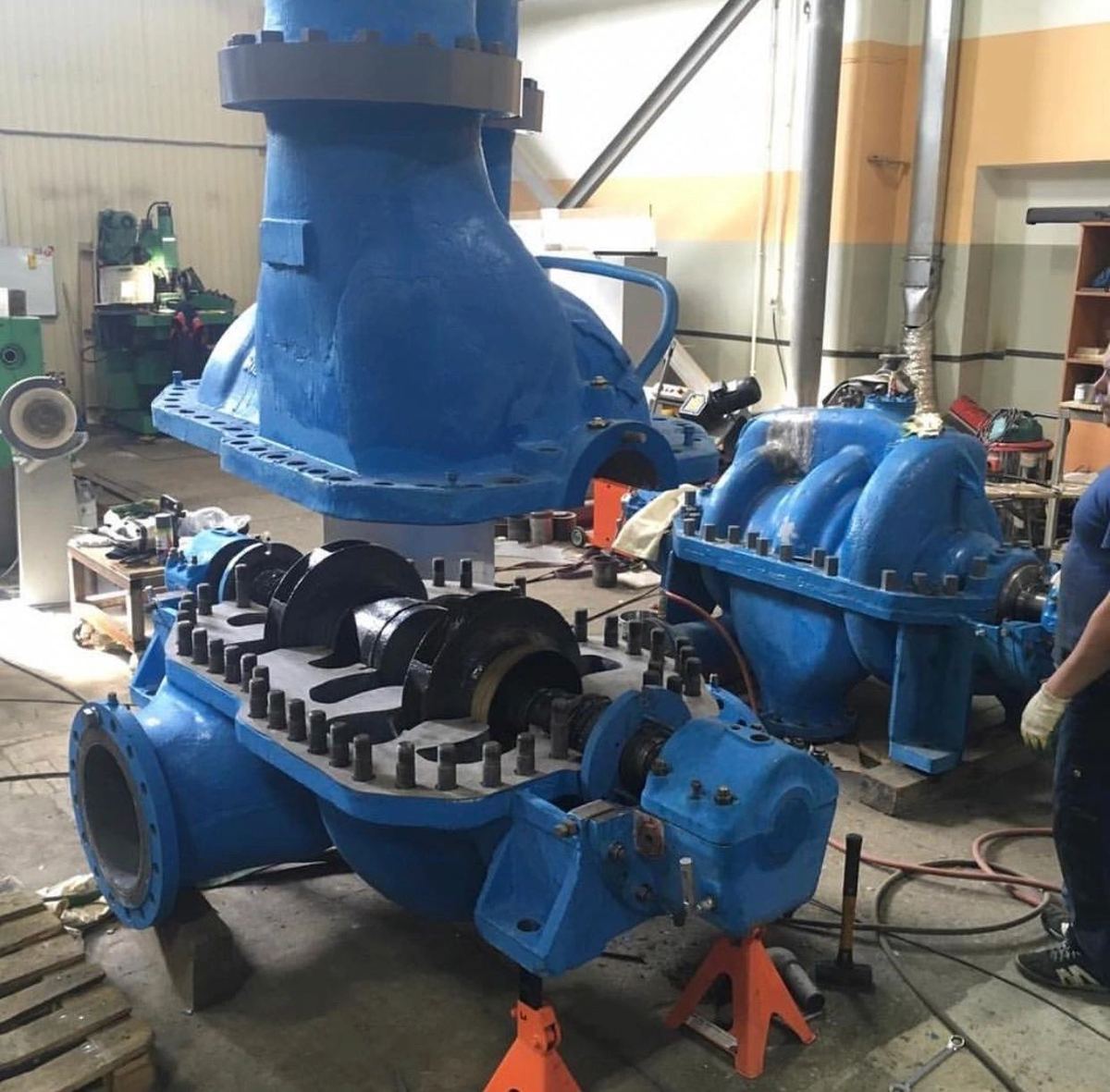 Blue split-case pumps lined up for rebuild in the IES pump repair shop